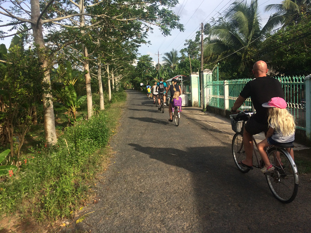 Mekong Delta Tour riding bicycle through the village