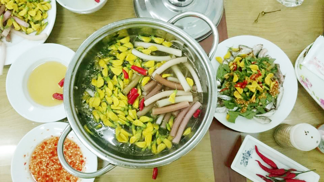 Siamese Fish hotpot with common sesban flower