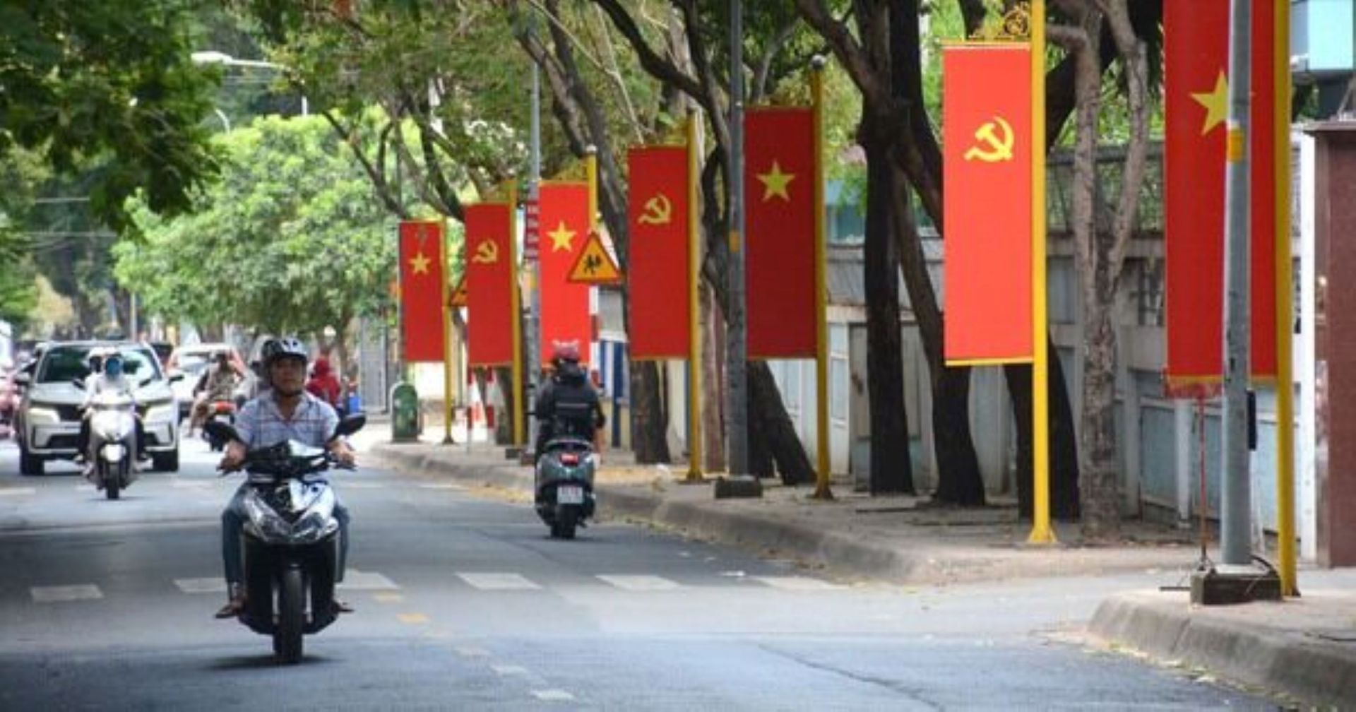Vibrant Ho Chi Minh City: Vietnam Flags Adorn Streets for Reunification & Labor Day 30/4