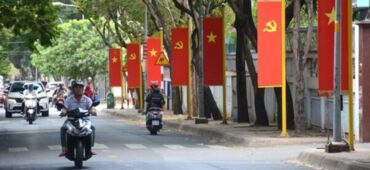 Vibrant Ho Chi Minh City: Vietnam Flags Adorn Streets for Reunification & Labor Day 30/4